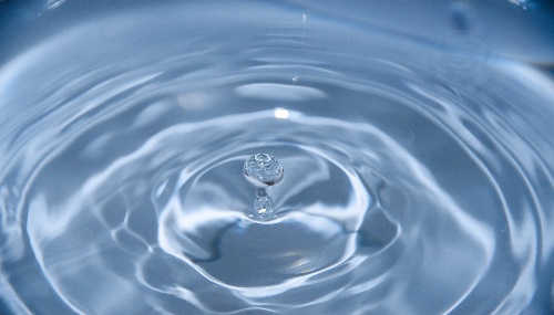 A drop of water falling into a pool