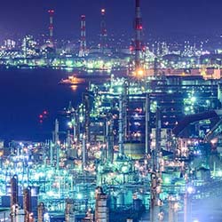 night view of well-lit refinery or factory