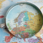 Magnifying glass on map of Northern Europe