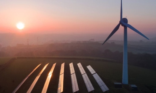 Sun rising on a windfarm.